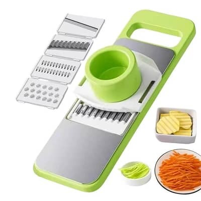 Green and gray vegetable chopper with attachments on a white background